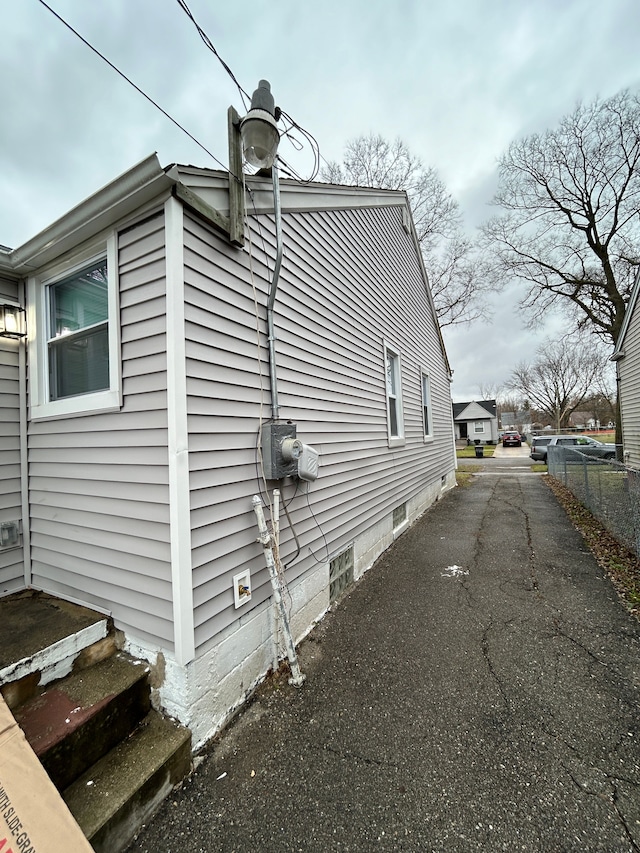 view of side of property with fence