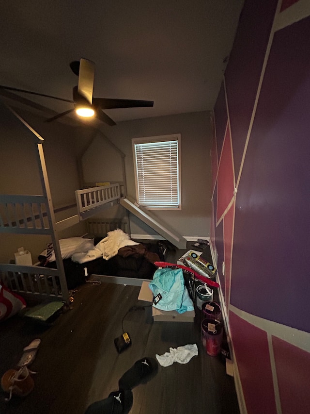 bedroom with ceiling fan and wood finished floors