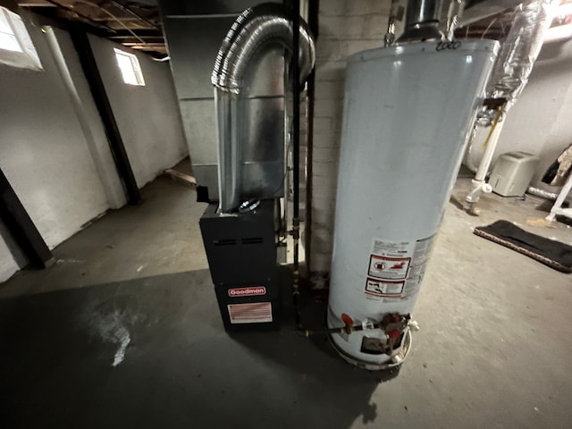 utility room featuring water heater