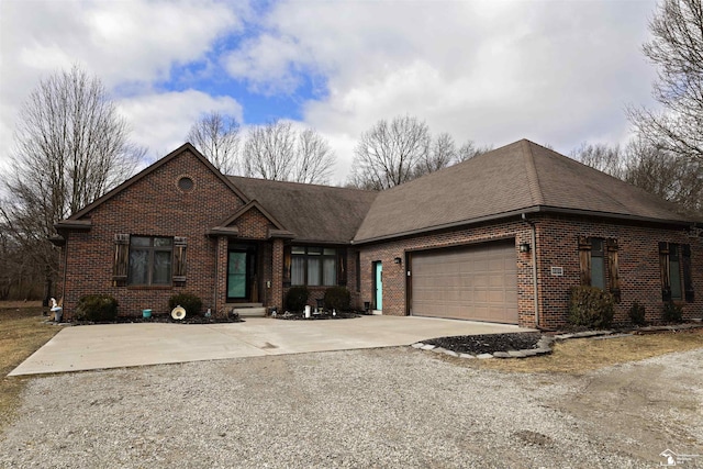 view of front of home with concrete driveway, an attached garage, brick siding, and roof with shingles