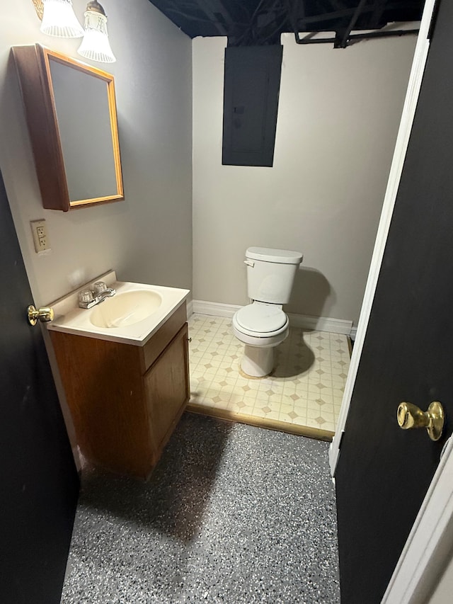 bathroom with electric panel, baseboards, toilet, and vanity