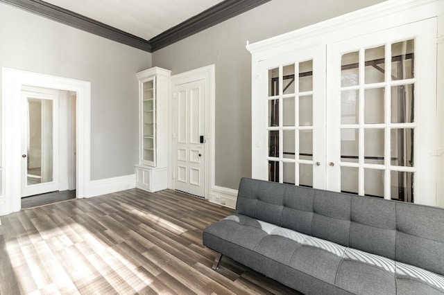 unfurnished room featuring dark wood-style floors, french doors, baseboards, and ornamental molding