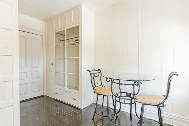 dining area featuring dark wood-style flooring