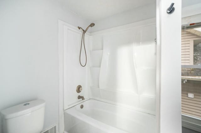 full bathroom featuring toilet and tub / shower combination