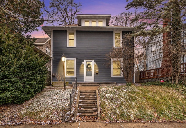 traditional style home with a wooden deck