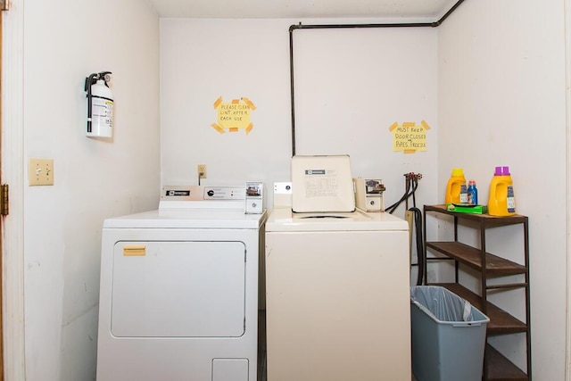 laundry area with separate washer and dryer