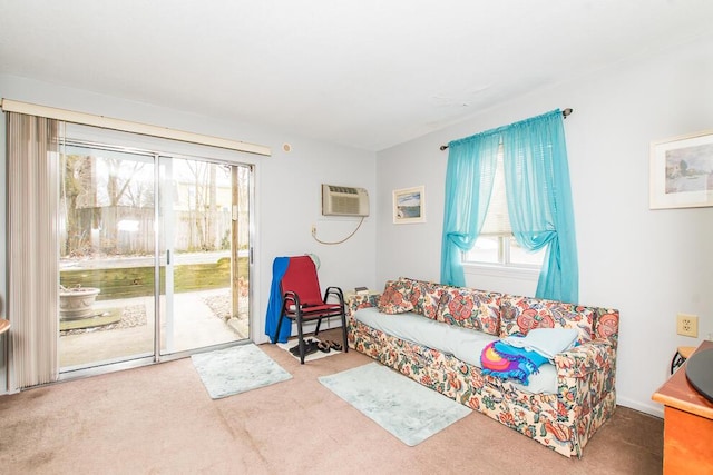 carpeted living room featuring a wall unit AC