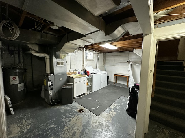 basement with visible vents, heating unit, electric water heater, washing machine and dryer, and stairs