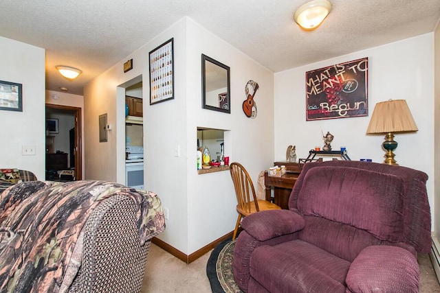 carpeted living room featuring a textured ceiling and baseboards