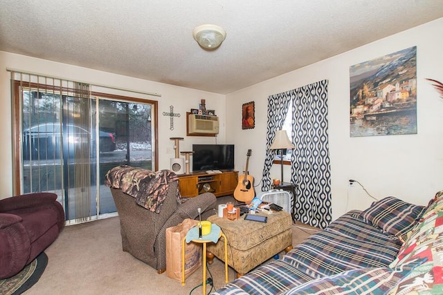 living room featuring light colored carpet, an AC wall unit, and a textured ceiling