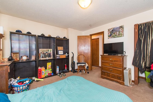 carpeted bedroom featuring a textured ceiling