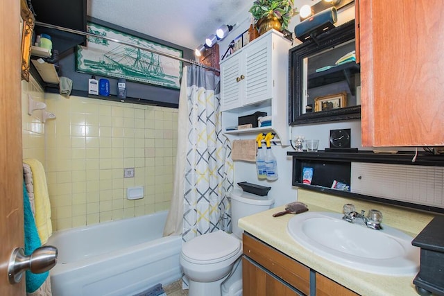 bathroom with toilet, shower / bath combo, and vanity