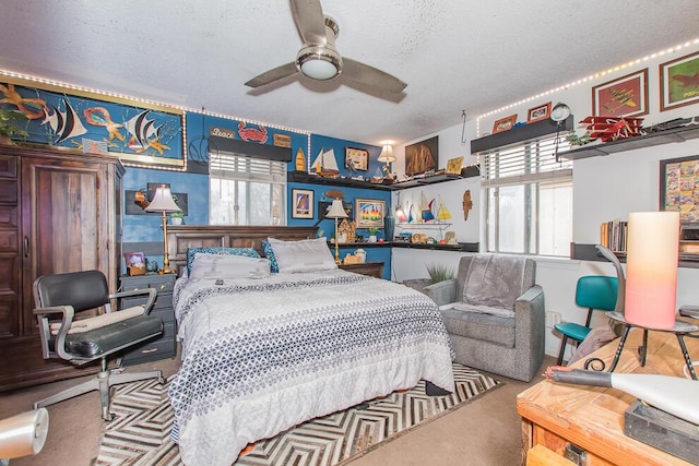 bedroom featuring multiple windows and a textured ceiling