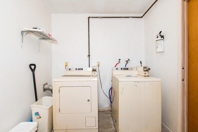 washroom featuring laundry area and independent washer and dryer