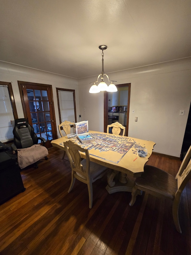 dining area with hardwood / wood-style flooring