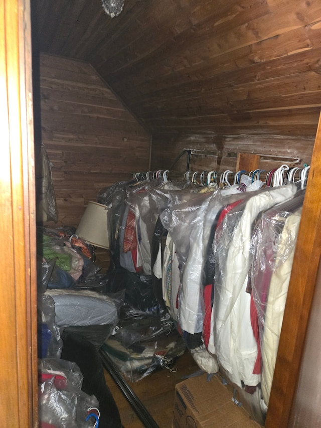 walk in closet featuring vaulted ceiling