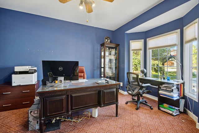 office area with baseboards and ceiling fan