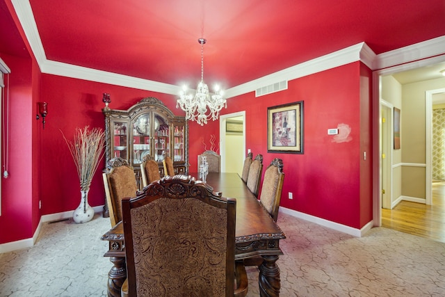 dining space with baseboards, visible vents, an inviting chandelier, ornamental molding, and carpet flooring