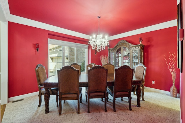 dining area with baseboards, visible vents, ornamental molding, a notable chandelier, and carpet flooring