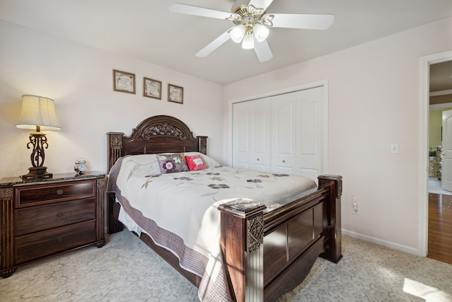 bedroom with baseboards, a closet, and ceiling fan