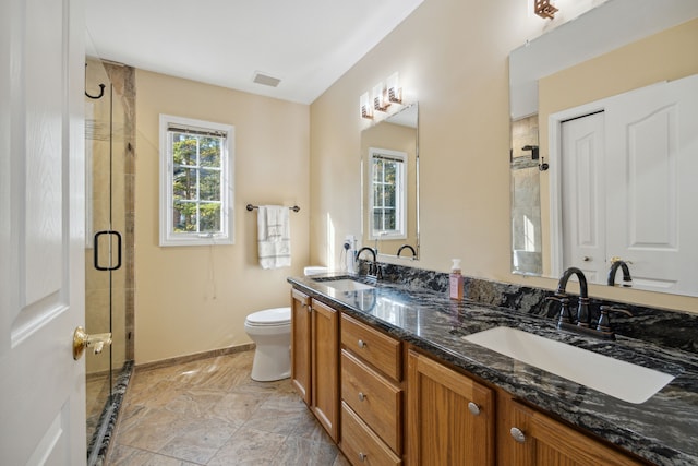 full bath featuring a sink, visible vents, toilet, and a stall shower