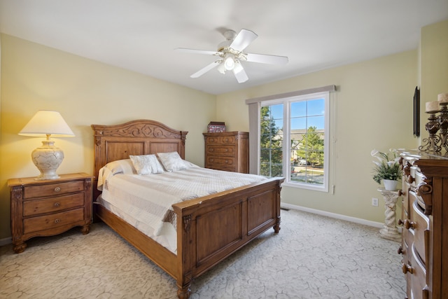 bedroom with baseboards, light carpet, and a ceiling fan