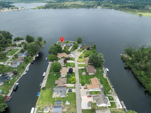 drone / aerial view featuring a residential view and a water view