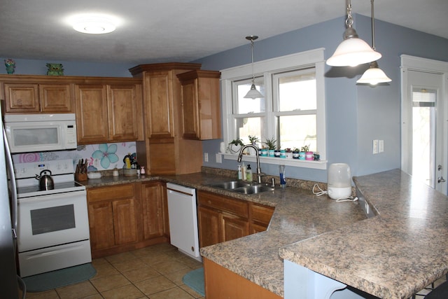 kitchen with pendant lighting, a sink, white appliances, a peninsula, and brown cabinetry