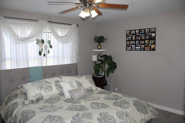 bedroom with baseboards and a ceiling fan