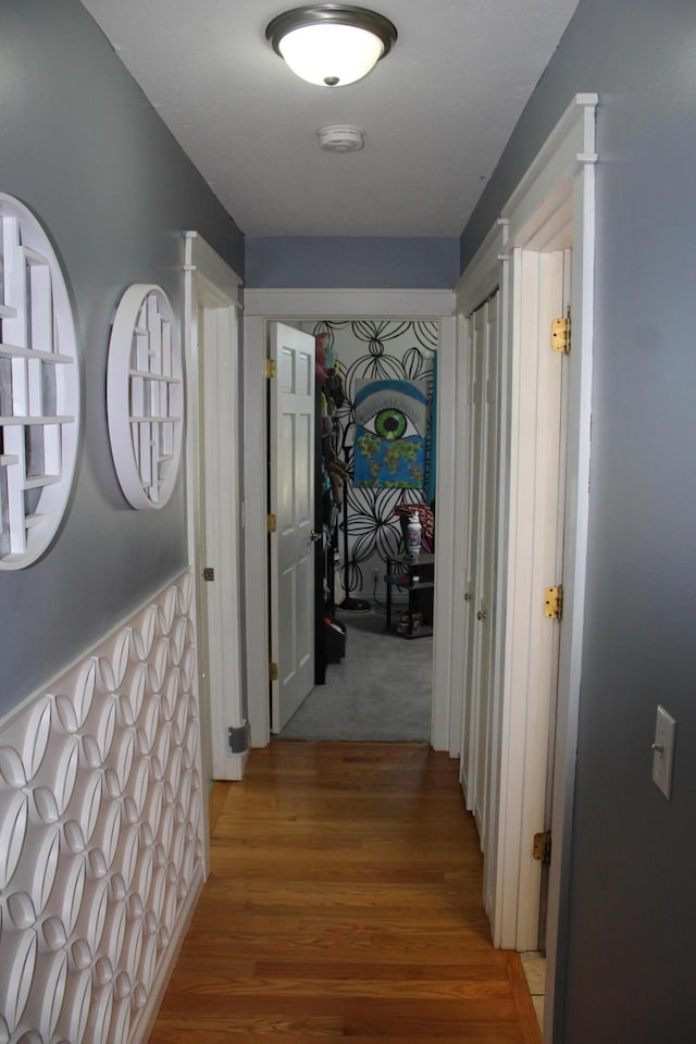 corridor with wood finished floors