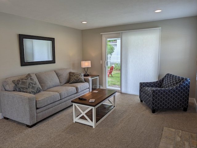 living area with recessed lighting and carpet floors