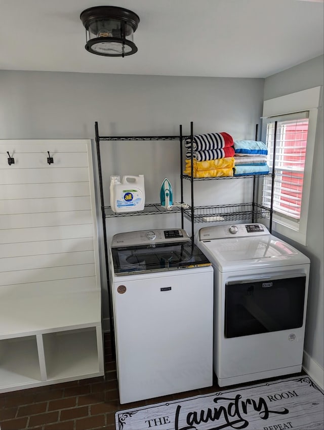 washroom with laundry area and washer and dryer