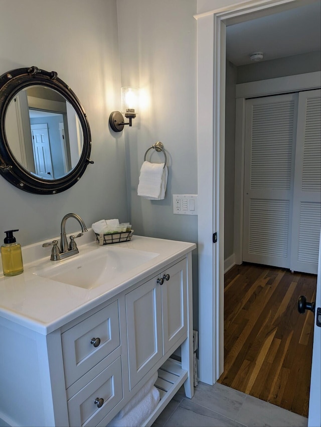 bathroom featuring vanity and wood finished floors