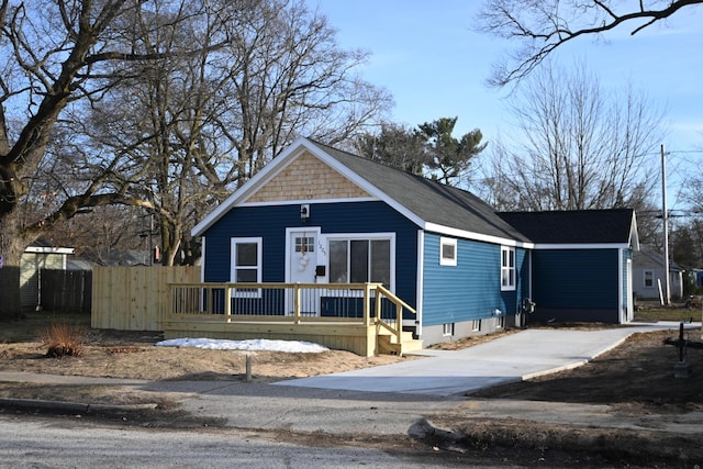 view of front of home featuring fence