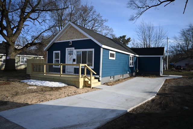 bungalow featuring a deck