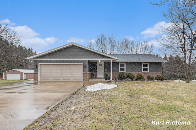 ranch-style house featuring a front yard, an attached garage, brick siding, and concrete driveway