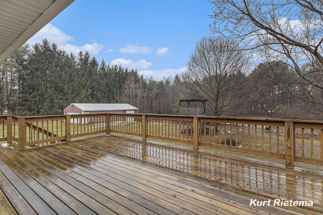 wooden terrace with an outbuilding