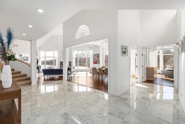 1265 Water Cliff Dr, Bloomfield Hills, MI 48302 - entrance foyer featuring marble tiled floors, a towering ceiling, recessed lighting, and stairs