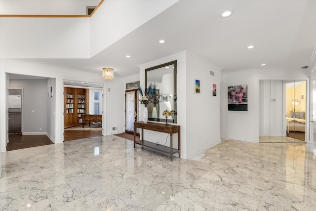1265 Water Cliff Dr, Bloomfield Hills, MI 48302 - foyer entrance with recessed lighting, marble tiled floors, and ornamental molding