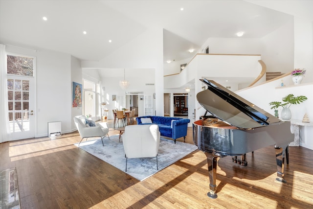 1265 Water Cliff Dr, Bloomfield Hills, MI 48302 - living room featuring a chandelier, wood finished floors, high vaulted ceiling, and recessed lighting