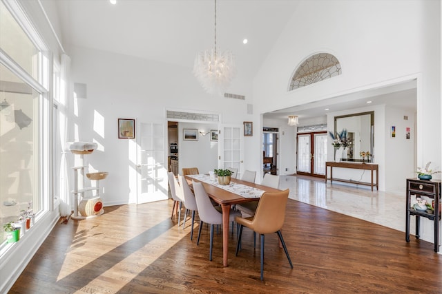 1265 Water Cliff Dr, Bloomfield Hills, MI 48302 - dining space featuring french doors, plenty of natural light, a chandelier, high vaulted ceiling, and recessed lighting