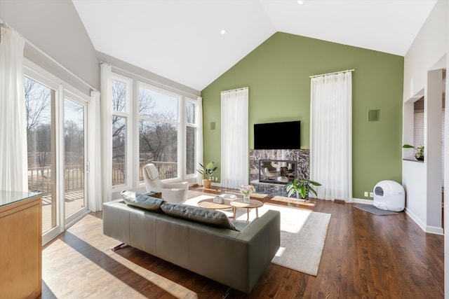 1265 Water Cliff Dr, Bloomfield Hills, MI 48302 - living area featuring high vaulted ceiling, wood finished floors, and a premium fireplace