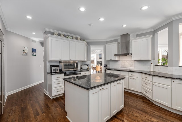 1265 Water Cliff Dr, Bloomfield Hills, MI 48302 - kitchen with wall chimney range hood, stainless steel microwave, plenty of natural light, black electric cooktop, and ornamental molding