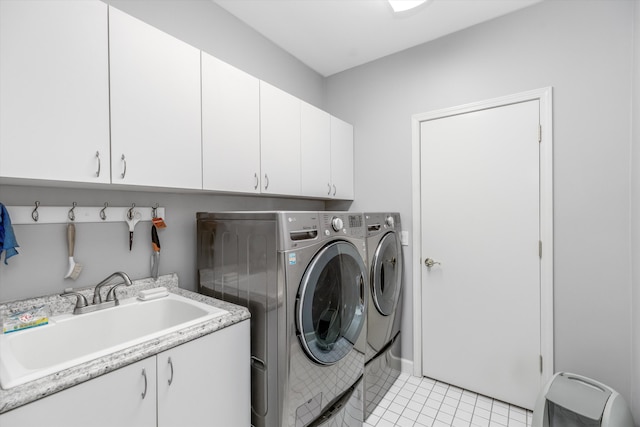1265 Water Cliff Dr, Bloomfield Hills, MI 48302 - washroom featuring cabinet space, independent washer and dryer, and light tile patterned flooring