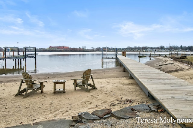 dock area with a water view