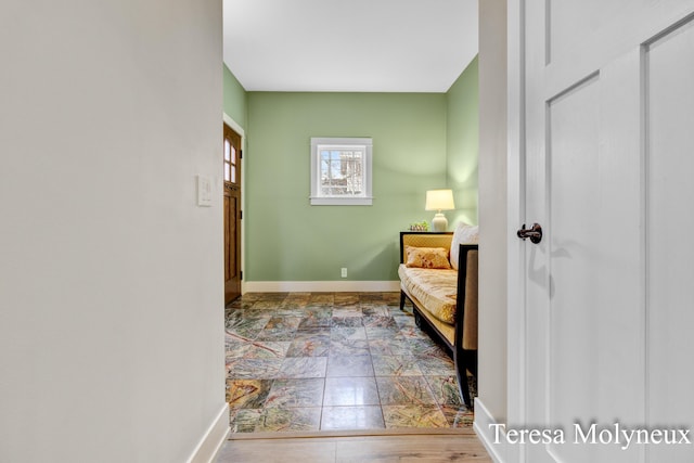 interior space with stone finish flooring and baseboards