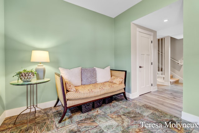 living area featuring stairs, recessed lighting, and baseboards