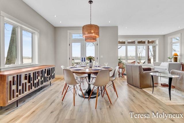 dining area with recessed lighting, light wood-type flooring, and baseboards