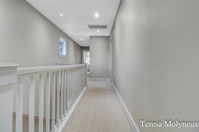 hallway with recessed lighting, visible vents, carpet floors, and baseboards