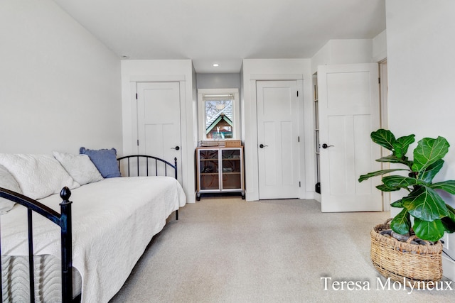 bedroom with recessed lighting and carpet